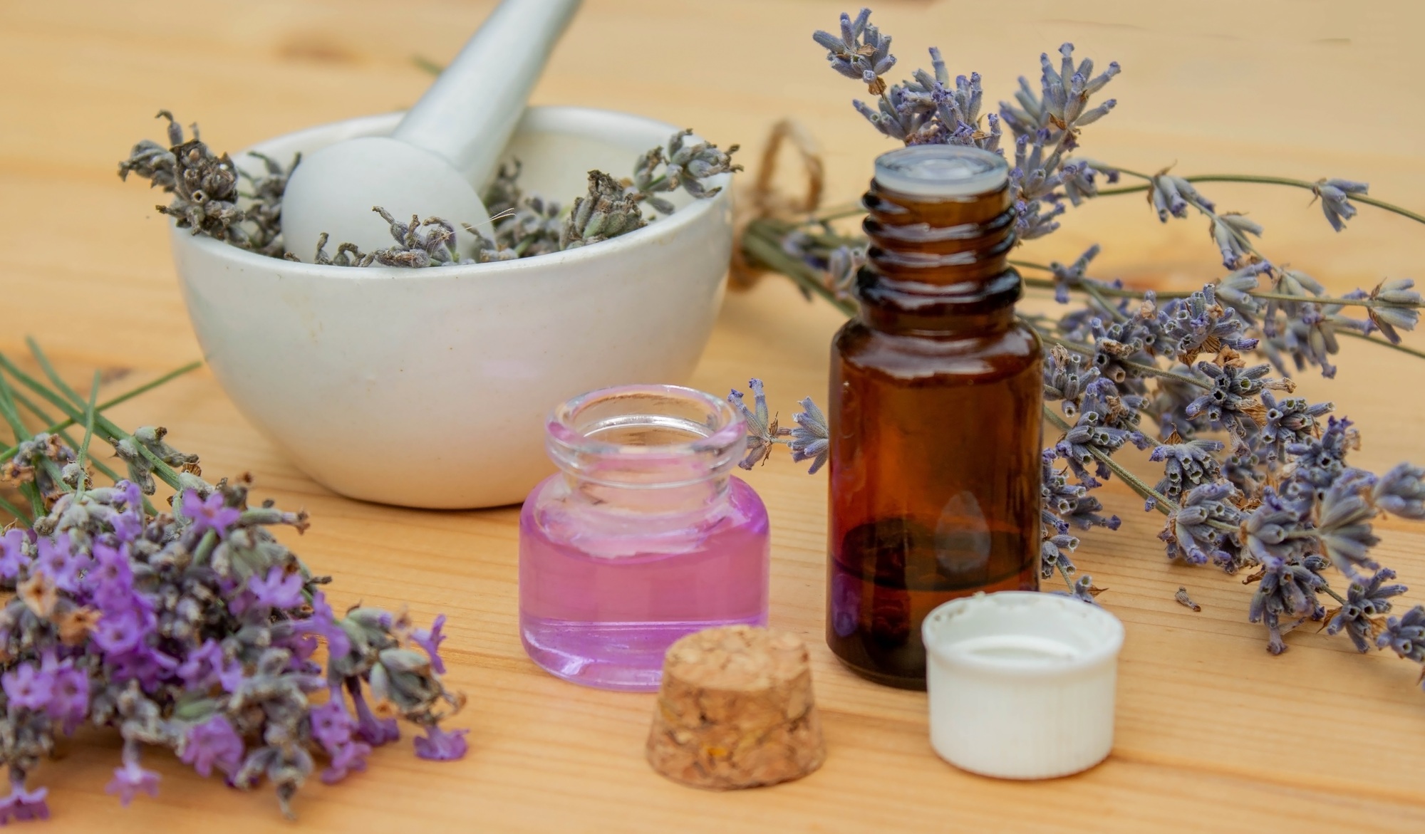 lavender essential oil, on a wooden background. Selective focus.